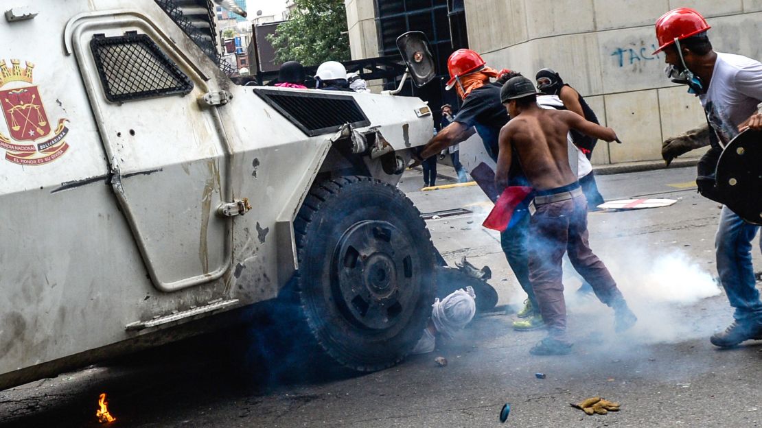 Armored military vehicles fighting against protesters