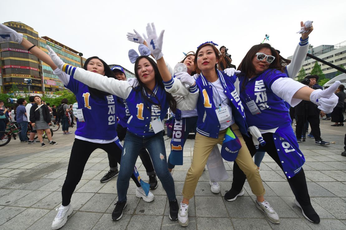 Supporters of South Korean presidential candidate Moon Jae-In of the Democratic Party dance during an election campaign in Goyang city, northwest of Seoul.
