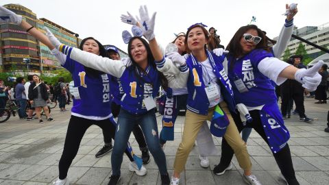 Supporters of South Korean presidential candidate Moon Jae-In of the Democratic Party dance during an election campaign in Goyang city, northwest of Seoul.