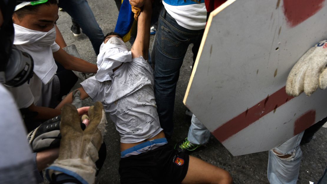 Other protesters helped get Yaminne out of harm's way.