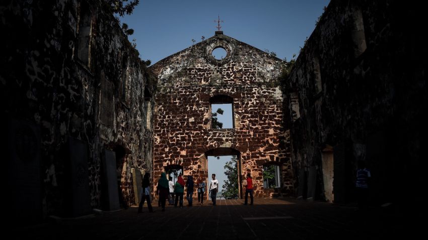 In this picture taken on September 3, 2015 tourists visit the 16th century St Pauls church in Malaysia's historical city of Malacca. The Portuguese were the first to arrive in the historical port city of Malacca in the 15th century and ruled for 130 years, before the Dutch captured it in 1641. After almost 183 years they gave it up to the next colonial rulers, Britain. Malacca was declared a UNESCO world heritage city in 2008.     AFP PHOTO / MANAN VATSYAYANA        (Photo credit should read MANAN VATSYAYANA/AFP/Getty Images)