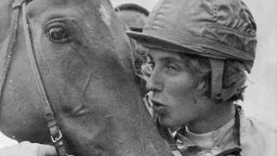 Diane Crump, apprentice jockey, kisses her mount,  Tou Ritzi, after winning the second race at Churchill Downs in Louisville, Kent., April 29, 1969. This was her fifth win as a jockey and first at Churchill Downs. (AP Photo/Gene Herrick)