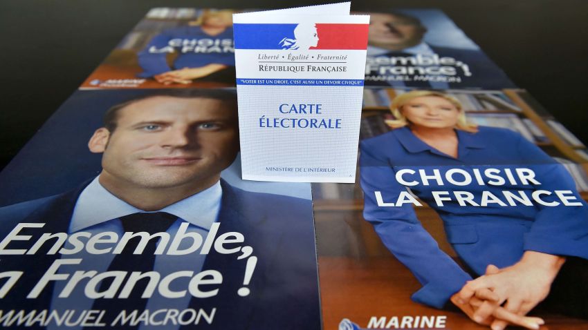 A picture taken on May 4, 2017 shows a voter ID displayed on top of campaign flyers of French presidential candidates Emmanuel Macron and Marine Le Pen in Nantes on May 4, 2017 ahead of the second round of the presidential election on May 7. / AFP PHOTO / LOIC VENANCE (Photo credit should read LOIC VENANCE/AFP/Getty Images)