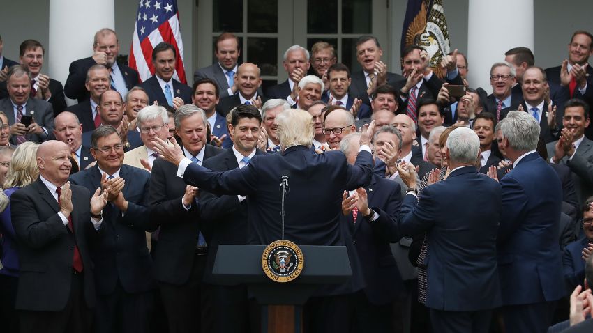 WASHINGTON, DC - MAY 04: President Donald Trump (C) congratulates House Republicans after they passed legislation aimed at repealing and replacing ObamaCare, during an event in the Rose Garden at the White House, on May 4, 2017 in Washington, DC. (Photo by Mark Wilson/Getty Images)