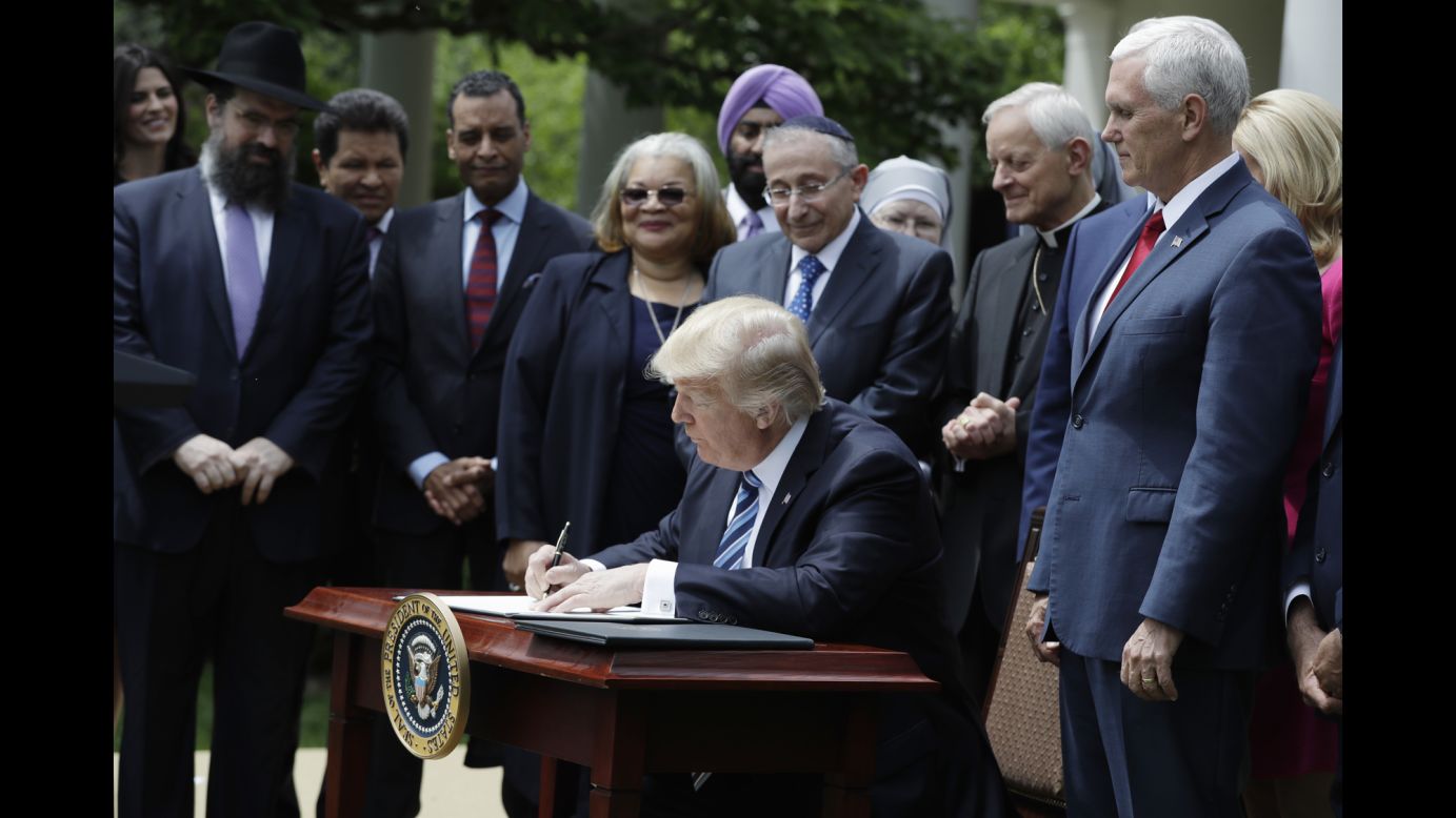 President Trump signs an executive order in the White House Rose Garden on Thursday, May 4. <a href="http://www.cnn.com/2017/05/03/politics/trump-religious-liberty-executive-order/" target="_blank">The order</a> directs the Internal Revenue Service not to take "adverse action" against churches and other tax-exempt religious organizations that participate in political activity. 