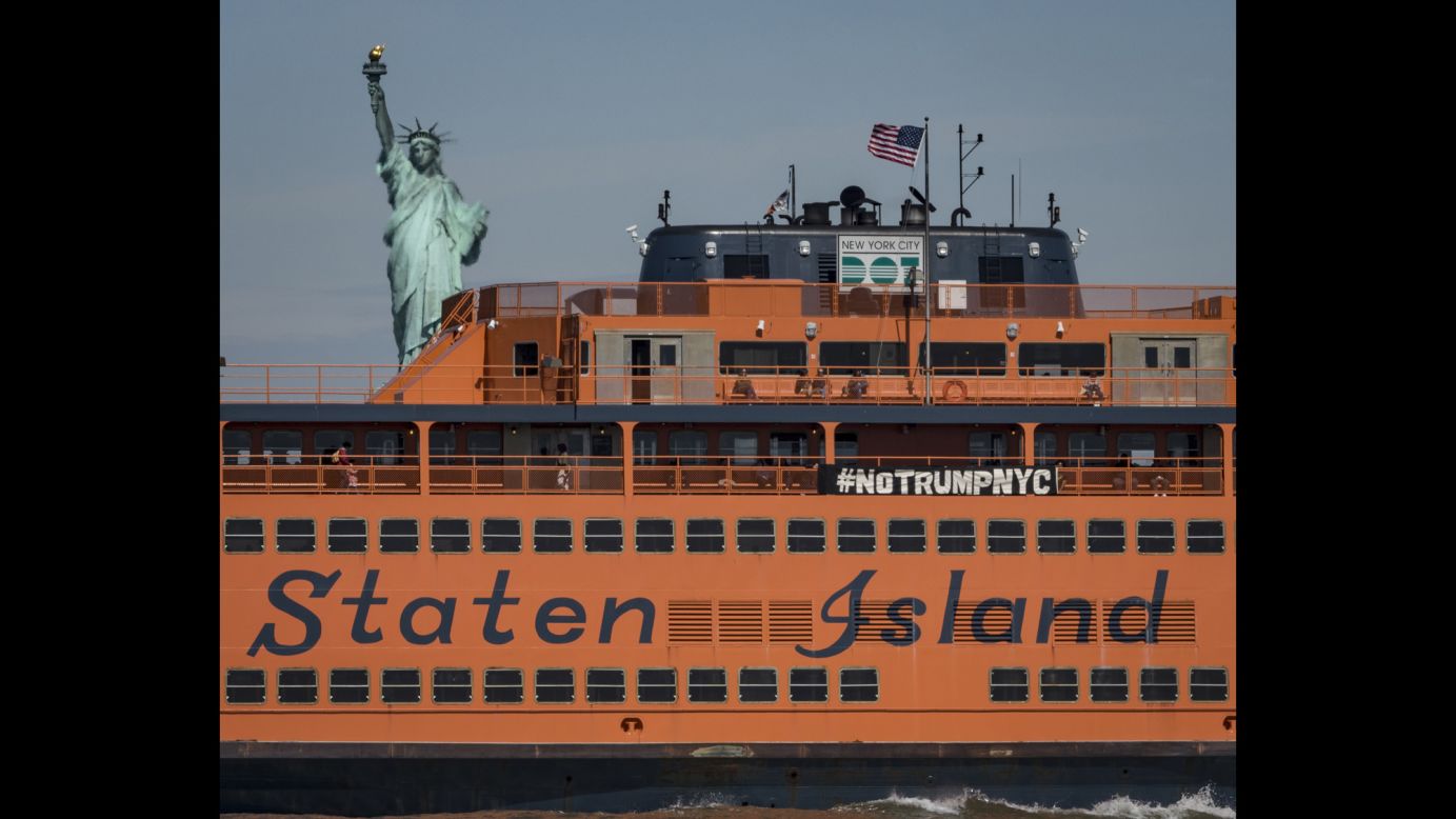 Activists hang an anti-Trump banner from the Staten Island Ferry on Thursday, May 4. The President was making <a href="http://www.cnn.com/2017/05/03/politics/donald-trump-new-york-city/" target="_blank">his first trip to New York</a> since his inauguration.