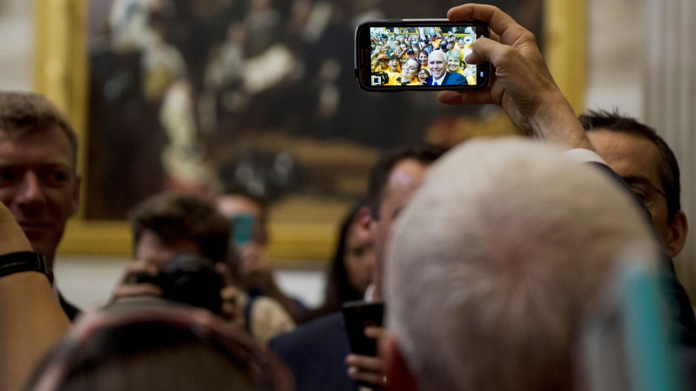 Vice President Mike Pence takes a selfie with a school group at the US Capitol on Tuesday, May 2.