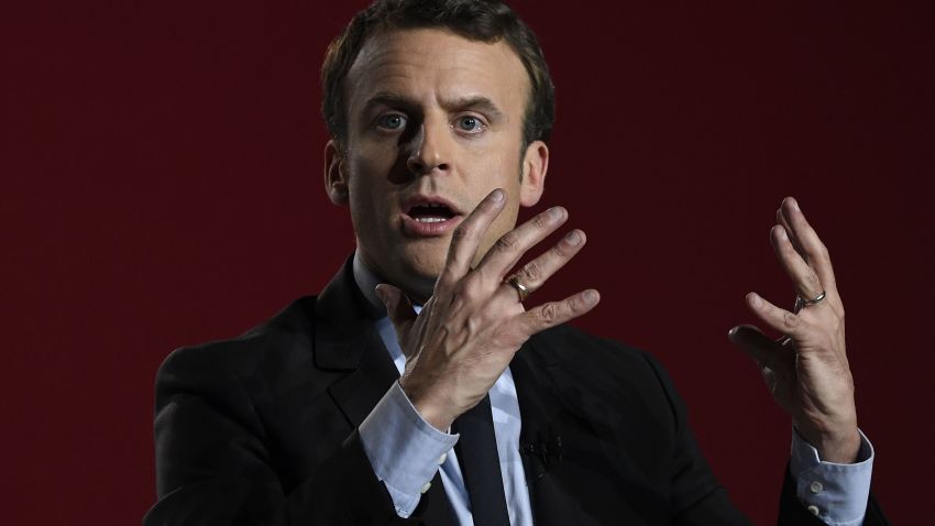 French presidential election candidate for the En Marche ! movement Emmanuel Macron gestures as he gives a speech during a meeting in Arras, on April 26, 2017, ahead of the second and final round of the presidential election. / AFP PHOTO / Eric FEFERBERG        (Photo credit should read ERIC FEFERBERG/AFP/Getty Images)