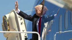 US President Donald Trump waves as he boards Air Force One prior to departing from Andrews Air Force Base in Maryland, April 18, as he travels to Wisconsin.