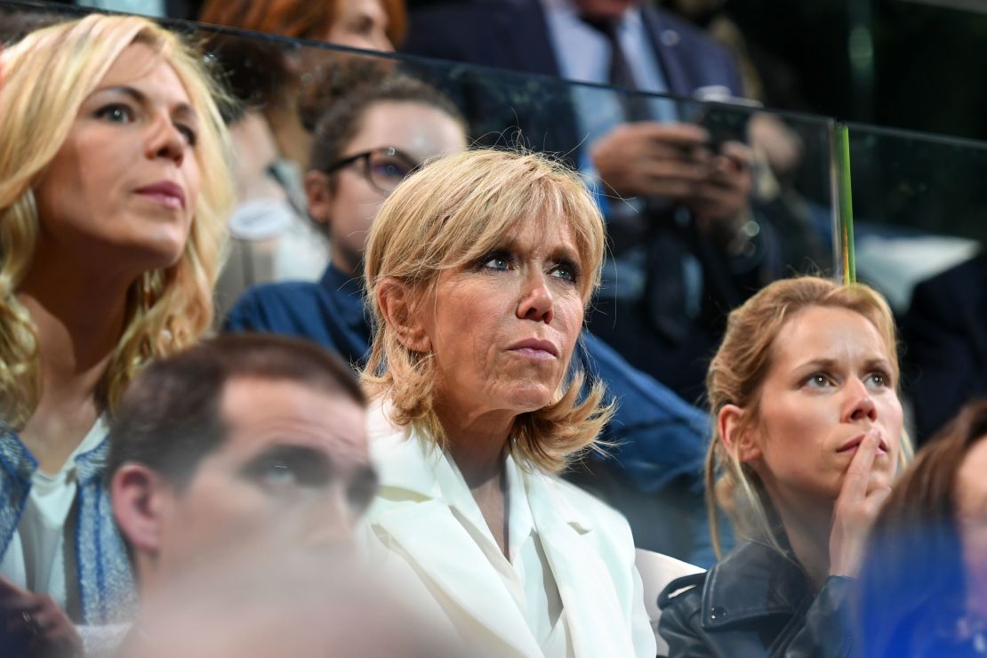 Trogneux (C) with her daughters Tiphaine Auziere (R) and Laurence Auziere-Jourdan at a campaign meeting in Paris.