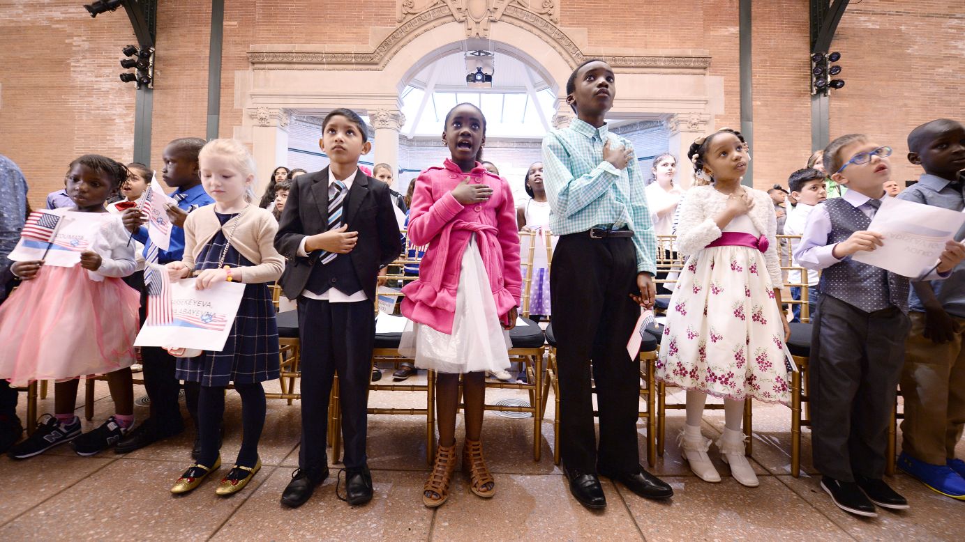 Children recite the national anthem before the start of a citizenship ceremony in New York on Friday, May 5. Thirty-two children, ranging in age from 5 to 13 years old, attended the ceremony and <a href="http://www.nydailynews.com/new-york/bronx/u-s-swears-in-32-kids-american-citizens-bronx-zoo-article-1.3140940" target="_blank" target="_blank">became US citizens.</a>