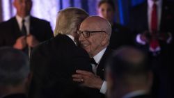 US President Donald Trump (L) is embraced by Rupert Murdoch, Executive Chairman of News Corp, during a dinner to commemorate the 75th anniversary of the Battle of the Coral Sea during WWII onboard the Intrepid Sea, Air and Space Museum May 4, 2017 in New York, New York. / AFP PHOTO / Brendan Smialowski        (Photo credit should read BRENDAN SMIALOWSKI/AFP/Getty Images)
