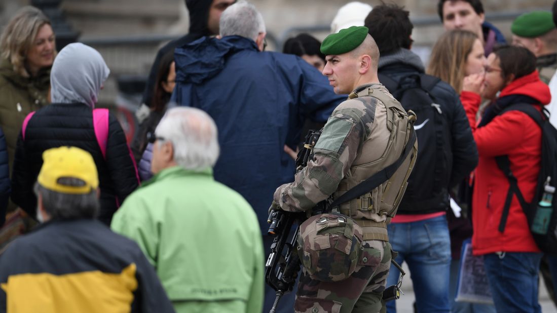 Soldiers patrol the grounds around The Louvre in Paris on May 7 where Emmanuel Macron will celebrate later should he win the election. Earlier in the day the The Louvre was cleared due to a security alert. 