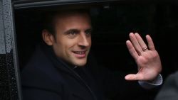 French independent centrist presidential candidate Emmanuel Macron, center, waves as he leaves the polling station after casting his ballot in the presidential runoff election in Le Touquet, France, Sunday, May 7.