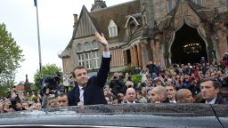 French independent centrist presidential candidate Emmanuel Macron, center, waves as he leaves the polling station after casting his ballot in the presidential runoff election in Le Touquet, France, Sunday, May 7, 2017. Voters across France are choosing a new president in an unusually tense and important election that could decide Europe's future, making a stark choice between pro-business progressive candidate Emmanuel Macron and far-right populist Marine Le Pen. (AP Photo/Thibault Camus)