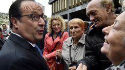 Outgoing French president Francois Hollande (L) meets people after casting his ballot at a polling station in Tulle, central France, on May 7, 2017, during the second round of the French presidential election. / AFP PHOTO / POOL / GEORGES GOBET        (Photo credit should read GEORGES GOBET/AFP/Getty Images)
