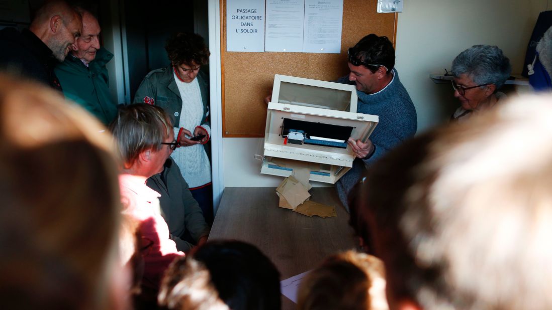 Voting officials count the votes at a polling station on the Island of Chausey, France.