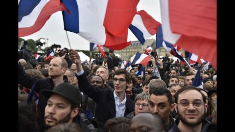 Supporters of French presidential candidate Emmanuel Macron celebrate outside the Louvre in Paris after Macron won the second round of the election.