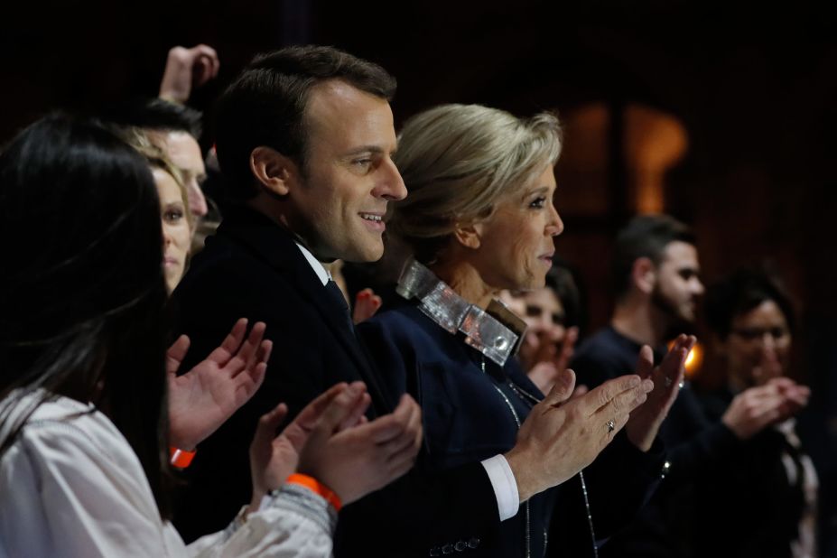 French President-elect Emmanuel Macron stands with his wife Brigitte Trogneux in front of the Pyramid at the Louvre Museum in Paris on Sunday, May 7, 2017, after the second round of the French presidential election. Macron soundly defeated far-right candidate Marine Le Pen.