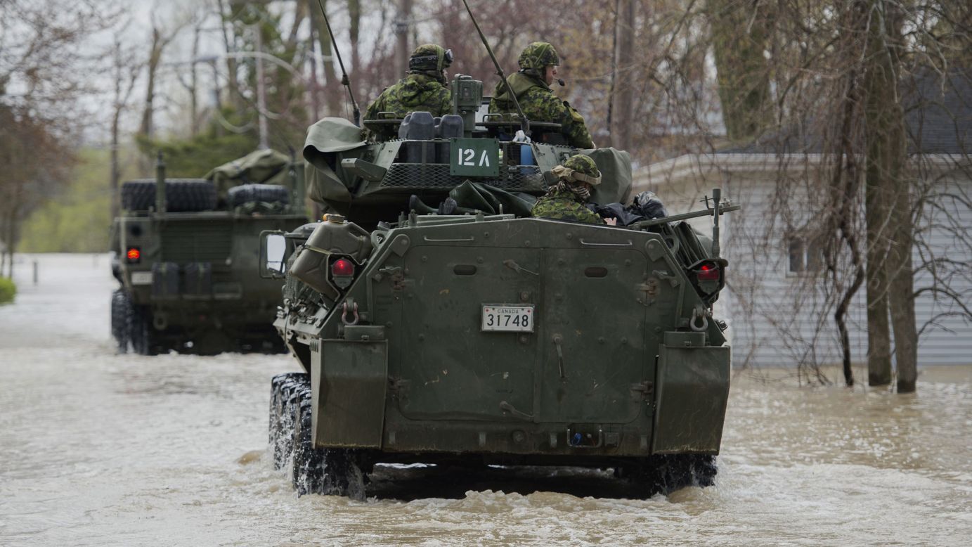 Members of the Canadian armed forces patrol a street in Rigaud on May 7.
