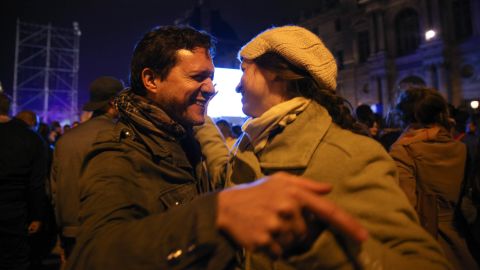 A couple dances at Macron's victory rally at the Louvre in Paris on Sunday night.