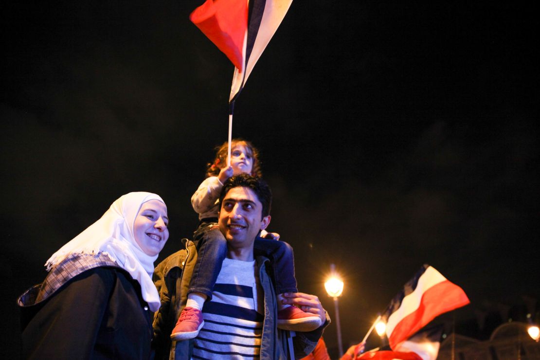 Anas Ammounah, a Syrian refugee, attends the celebrations with his family in Paris on May 7.