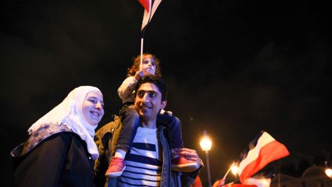 Anas Ammounah, a Syrian refugee, attends the celebrations with his family in Paris on May 7.