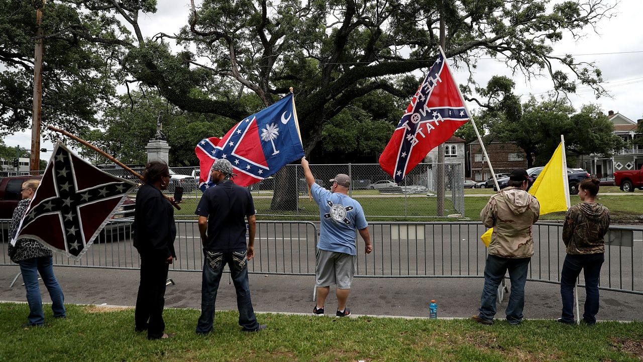 Protesters demonstrate across the street from the Jefferson Davis monument Sunday. 
