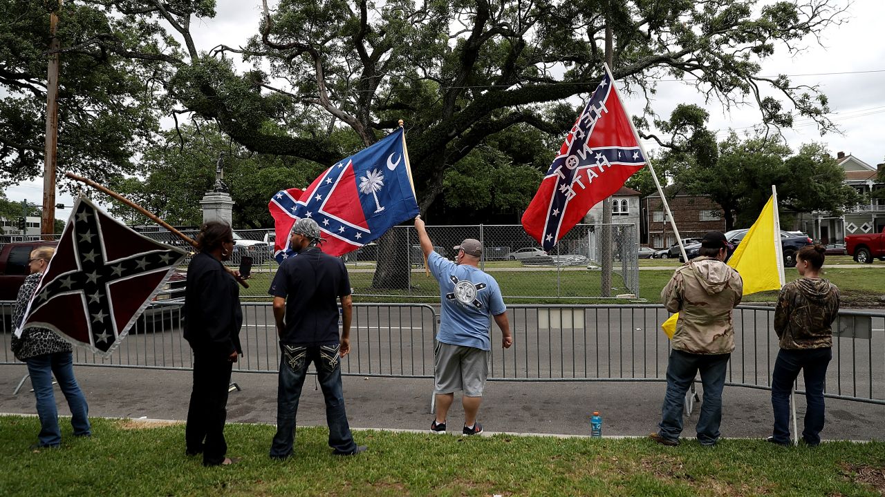 Protesters demonstrate across the street from the Jefferson Davis monument Sunday.