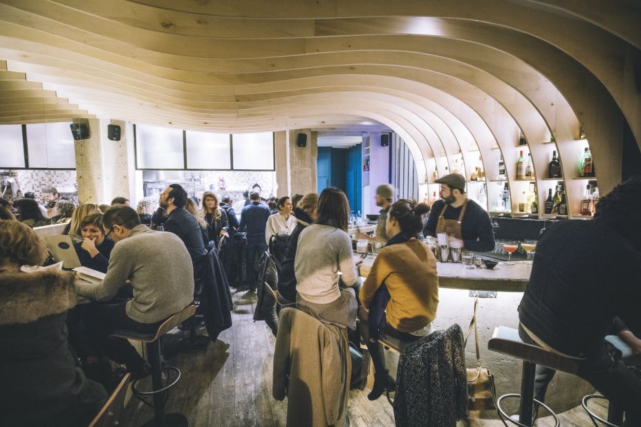 <strong>Gravity Bar:</strong> An undulating ceiling made of plywood "waves" sets the stage at Gravity Bar near the Canal Saint-Martin in Paris.