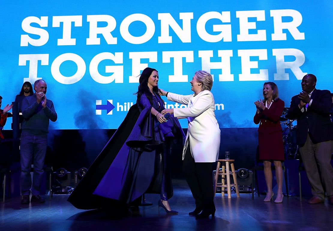 Democratic presidential nominee former Secretary of State Hillary Clinton (R) greets recording artist Katy Perry (L) during a get-out-the-vote concert at the Mann Center for the Performing Arts on November 5, 2016 in Philadelphia, Pennsylvania.