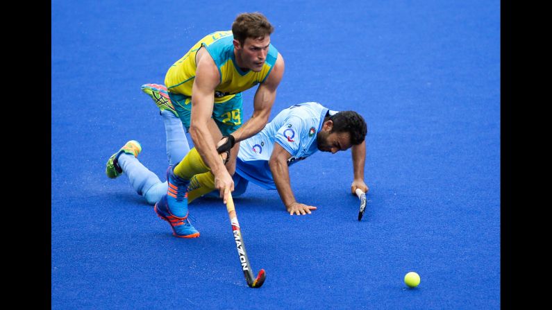Australia's Trent Mitton gets past India's Affan Yousuf during a field hockey tournament in Ipoh, Malaysia, on Tuesday, May 2.