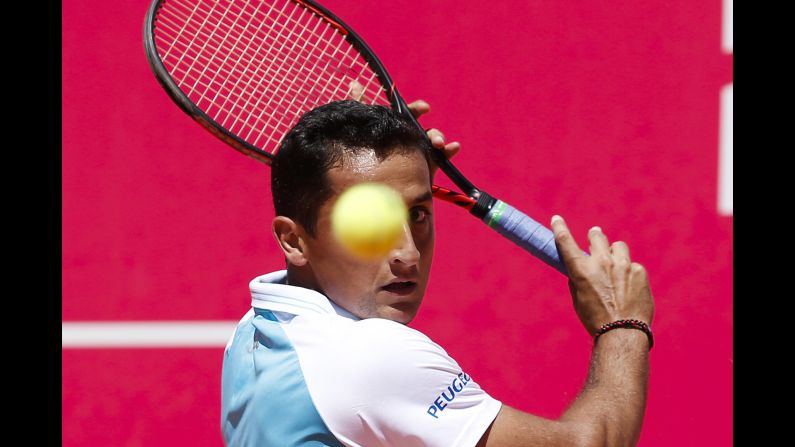 Nicolas Almagro prepares to hit a backhand during his first-round match at the Estoril Open in Portugal on Tuesday, May 2.