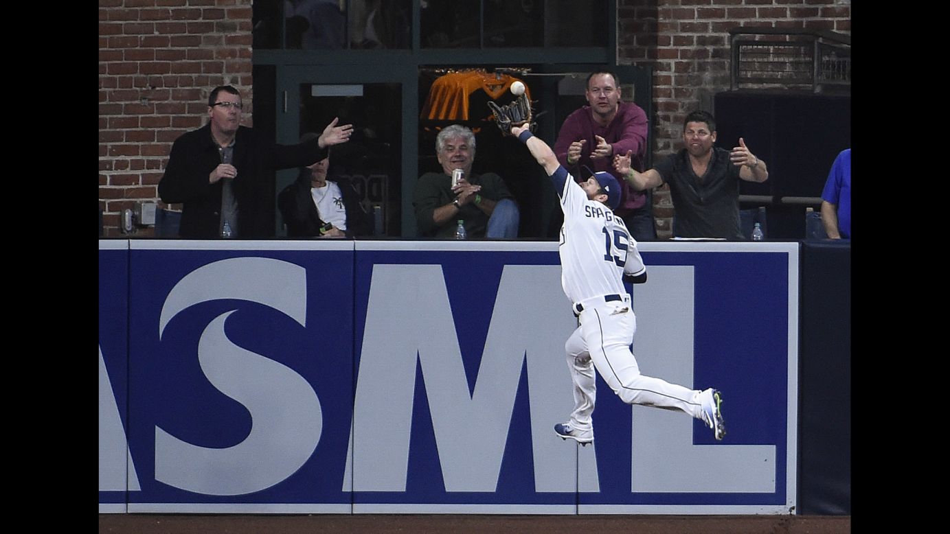 San Diego outfielder Cory Spangenberg leaps for a catch during a home game against Colorado on Tuesday, May 2.
