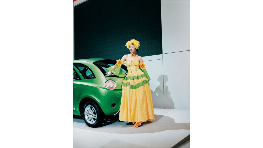 "The Dutch photographer <a href="http://www.jacquelinehassink.com/jh/site/paragraph/item/22136" target="_blank" target="_blank">Jacquline Hassink</a> spent five years photographing car shows in seven different cities across three continents in order to examine how major car brands ideal images of femininity to market their products and define their corporate identity." 