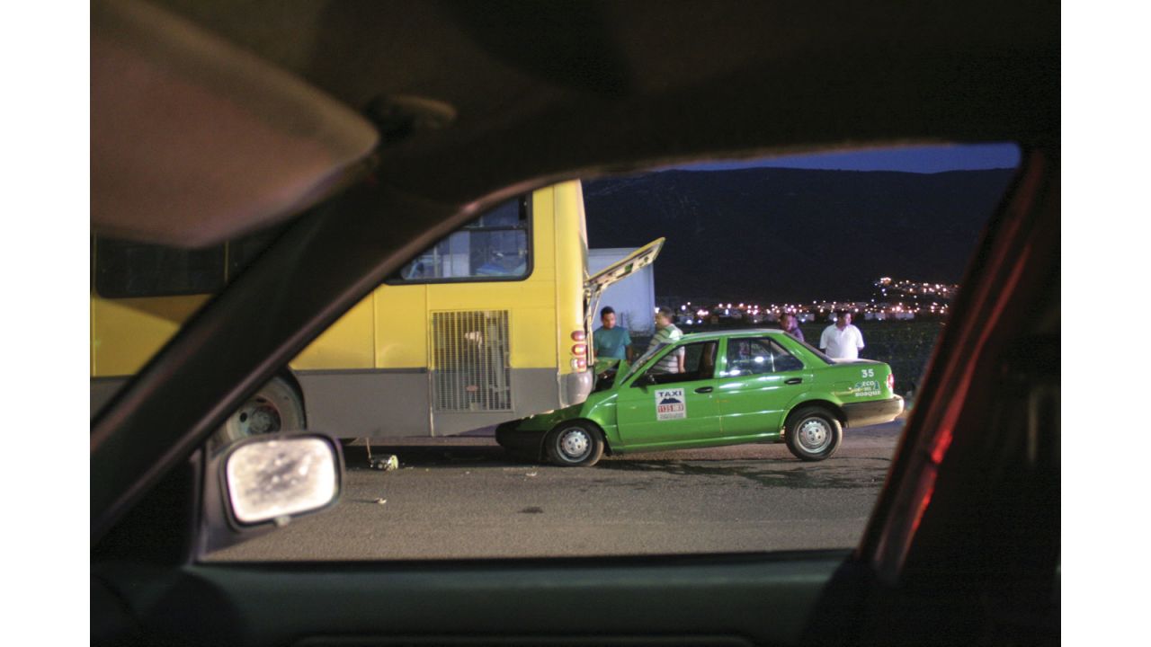 "It is interesting to see the many ways in which the car window is used as a compositional device in the works of the photographers presented in the exhibition. Gómez uses it systematically like a frame within a frame positioning the different scenes he observes from his car window centrally in the composition." 