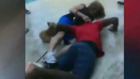 The video shows a teenager and a woman falling in a pool area in  North Lauderdale, Florida.