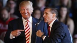 Republican presidential candidate Donald Trump jokes with retired Gen. Michael Flynn as they speak at a rally at Grand Junction Regional Airport on October 18, 2016 in Grand Junction Colorado.