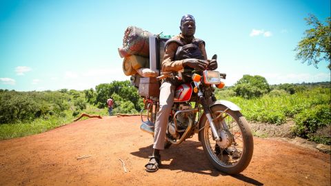 Victor Patrick has been helping the displaced carry the few belongings they were able to escape with to their new home in Uganda.