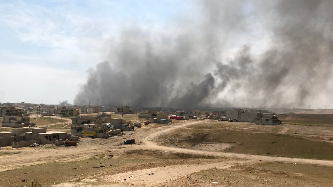 Smoke billows over Mosul as Iraqi security forces battle for ISIS'  last remaining stronghold.