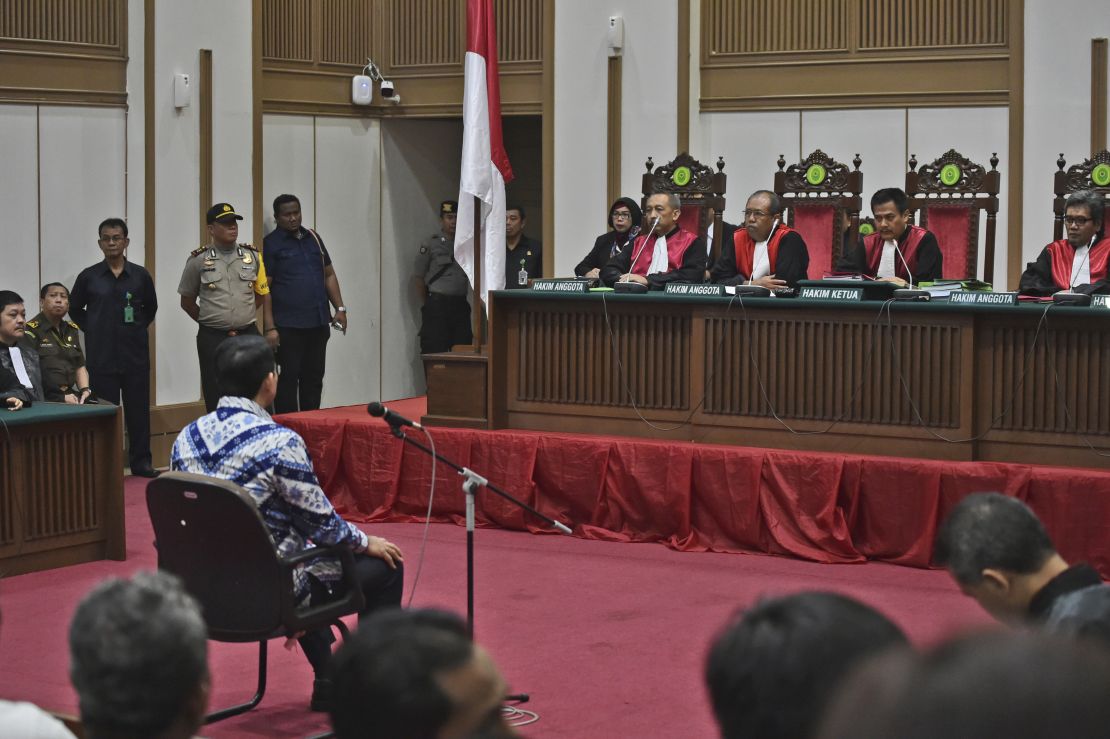 Ahok sits on the defendant's chair as he attends his sentencing hearing in Jakarta on May 9.