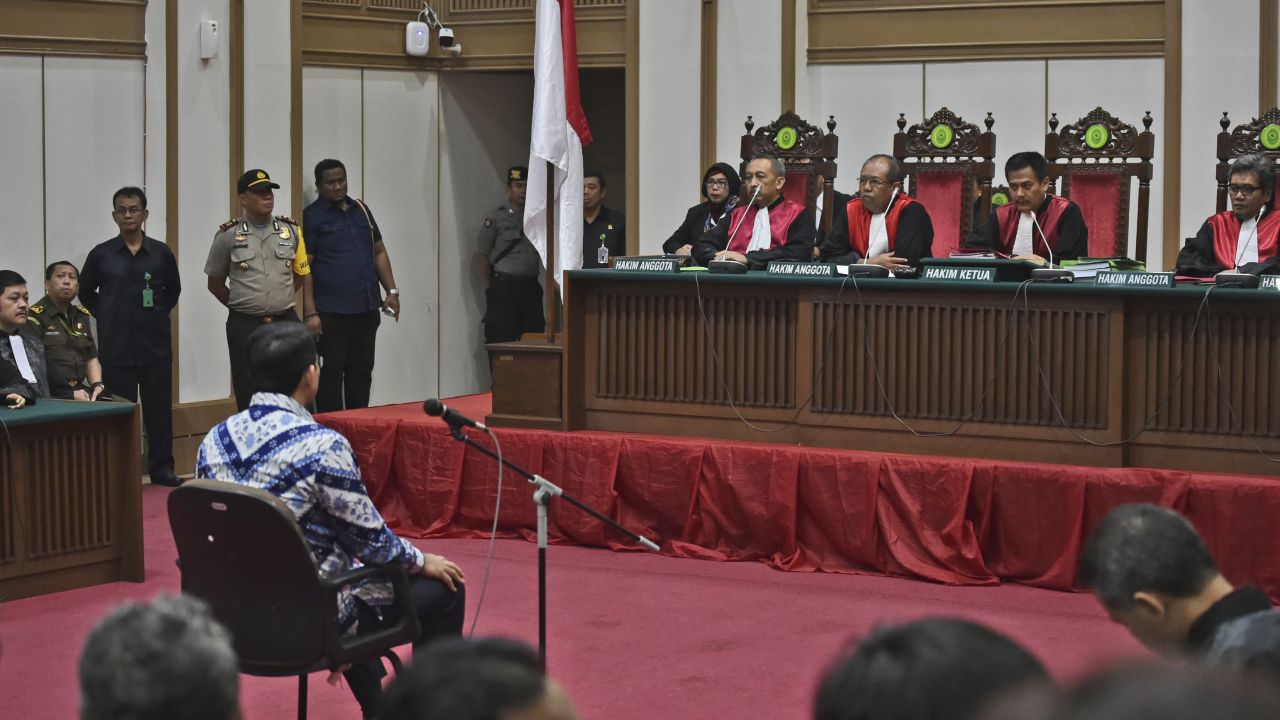 Ahok sits on the defendant's chair as he attends his sentencing hearing in Jakarta on May 9.