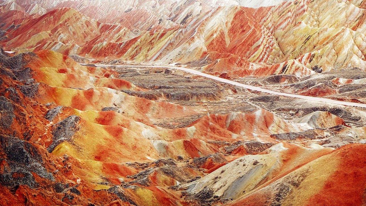 The otherworldly landscape of the Rainbow Mountains is a result of oxidation and erosion. (Yeung Ming/Flickr/CC by 2.0)