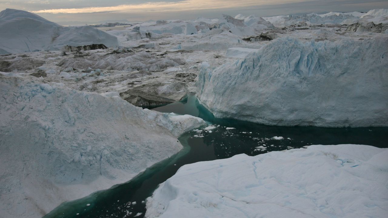 An aerial view of icebergs floating in the Jacobshavn Fjord, August 29, 2007 near the town of Ilulissat, Greenland. Scientists believe that Greenland, with its melting ice caps and disappearing glaciers, is an accurate thermometer of global warming. (Photo by Uriel Sinai/Getty Images)