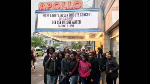 Hoffman and her students at the Apollo Theater in Harlem. 