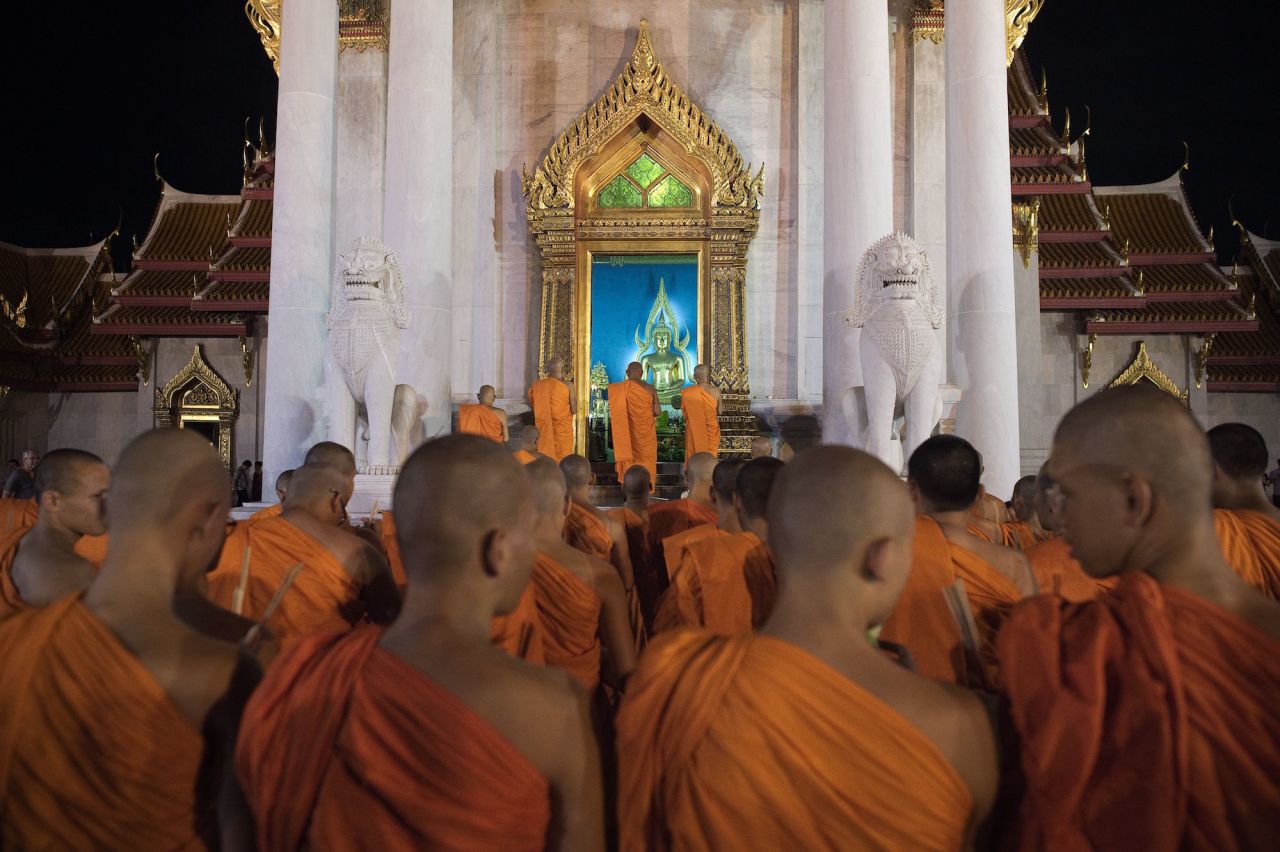 <strong>Bangkok, Thailand: </strong>Every year, temples all over Thailand alight with candles and incense as part of Vesak Day celebrations. Here, Thai Buddhist monks perform religious rites at Bangkok's Marble Temple.