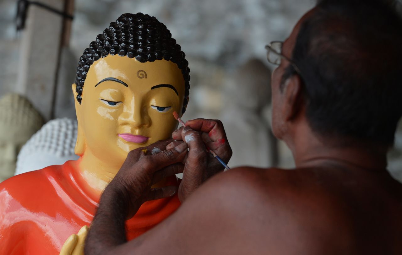 <strong>Dompe, Sri Lanka: </strong>A Sri Lankan artist works on Buddhist statues ahead of the Vesak Festival in Dompe, on the outskirts of Colombo, on May 7. 