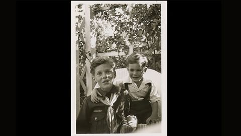 Kennedy wears his Cub Scout uniform as he poses with his brother, Tim, circa 1946.