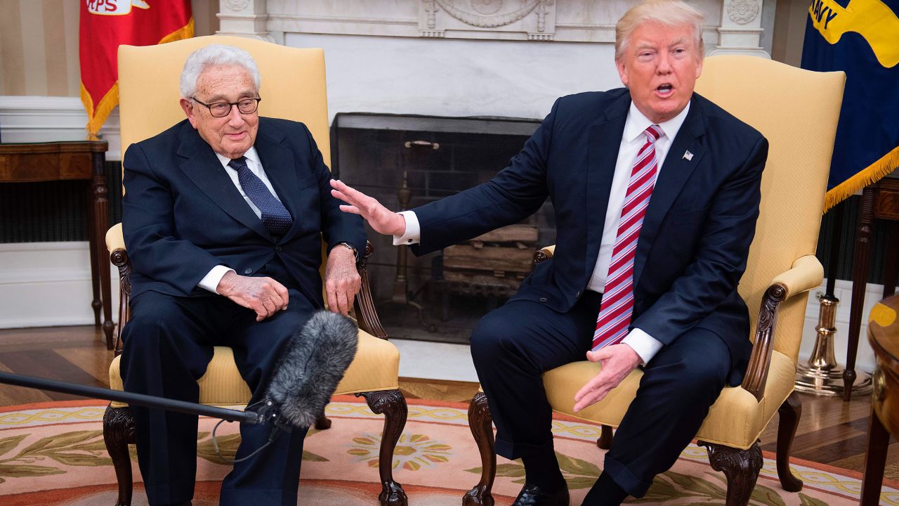 US President Donald Trump (R) speaks with former US Secretary of State Henry Kissinger during a meeting in the Oval Office of the White House in Washington, DC, May 10, 2017. / AFP PHOTO / JIM WATSON        (Photo credit should read JIM WATSON/AFP/Getty Images)