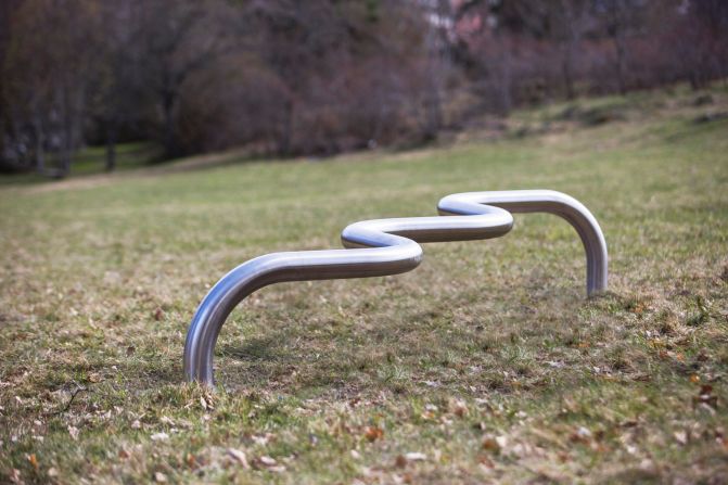 People can perch on, lean against, hang from or walk along London designer Max Lamb's gently zigzagging linear benches. Made from single lengths of stainless steel tube that was manipulated using a computer-controlled bending machine, the three benches are influenced by materials and forms found in urban environments.